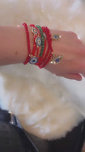 Trio Red Beaded Evil Eye charm stack bracelets.