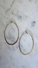 Flat Gold Oval Hoops.