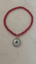 Trio Red Beaded Evil Eye charm stack bracelets.