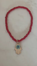 Trio Red Beaded Evil Eye charm stack bracelets.